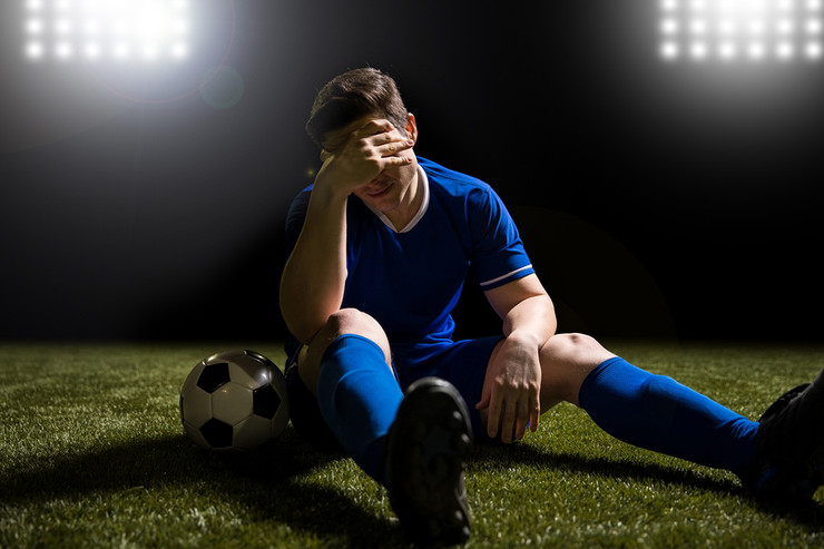 Football Player Looking Disappointed