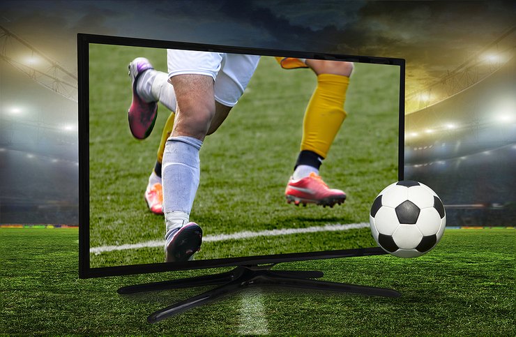 TV on Football Pitch Showing Match