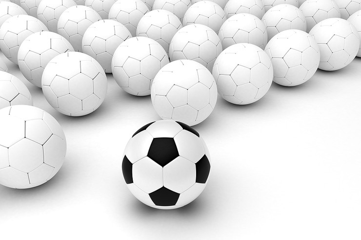 Black and White Football Separated From Plain Footballs
