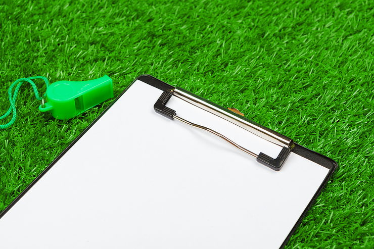Clipboard on Grass with Green Whistle