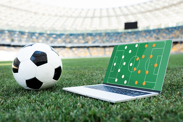 Football Formation on Laptop on Stadium Pitch