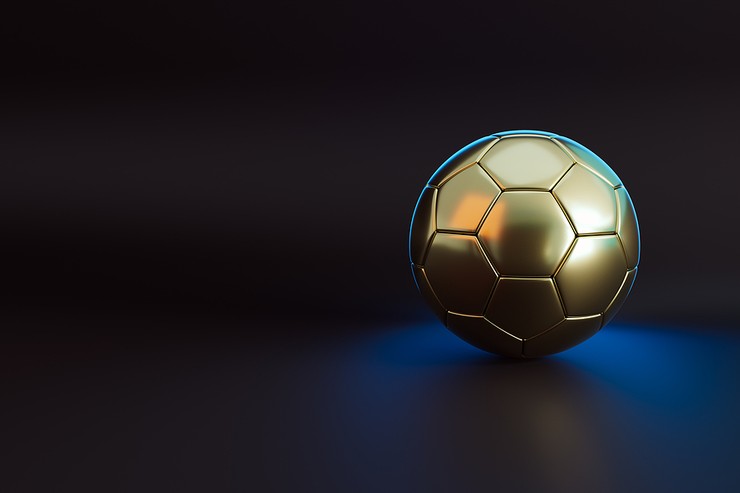 Gold Football Under Blue Spotlight